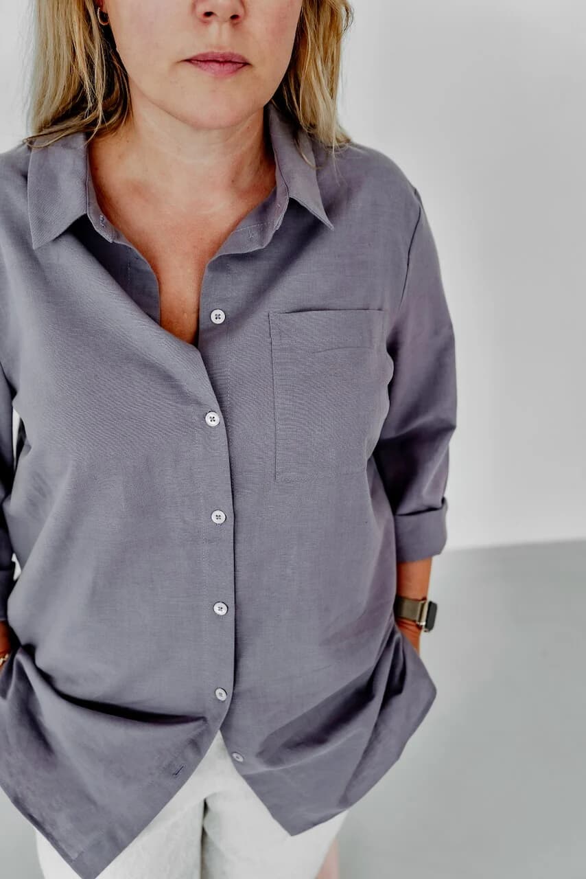 Woman in blue tunic and patterned pants